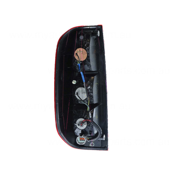 Red/Clear Tail Lamp Drivers Side OEM Suits Nissan Navara D40 2005 to 2015