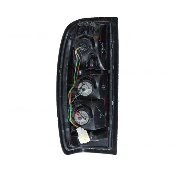 Tail Lamp Drivers Side OEM Suits Nissan Navara D22 2001 to 2015
