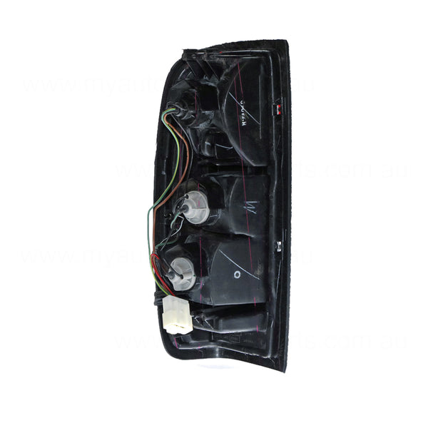 Tail Lamp Drivers Side OEM Suits Nissan Navara D22 2001 to 2015